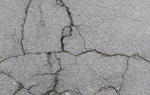 repair cracks in a concrete driveway